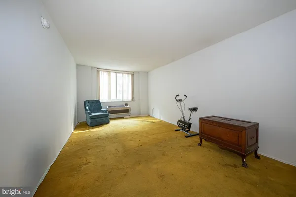 a bedroom with bed and window