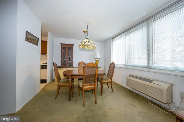 a view of a dining room with furniture window and outside view
