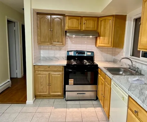a kitchen with a stove and a sink