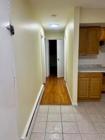 a view of a livingroom with an empty space and a fireplace