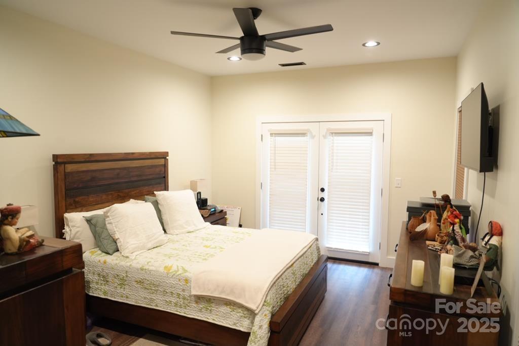 79 Abbey View Road Bryson City, NC 28713 - Photo 16 of 21 a bedroom with a bed and a flat screen tv