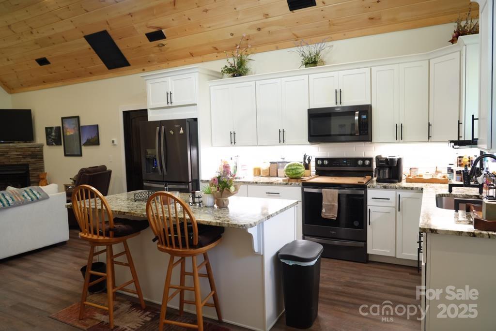 79 Abbey View Road Bryson City, NC 28713 - Photo 9 of 21 a kitchen with stainless steel appliances a stove refrigerator sink and microwave
