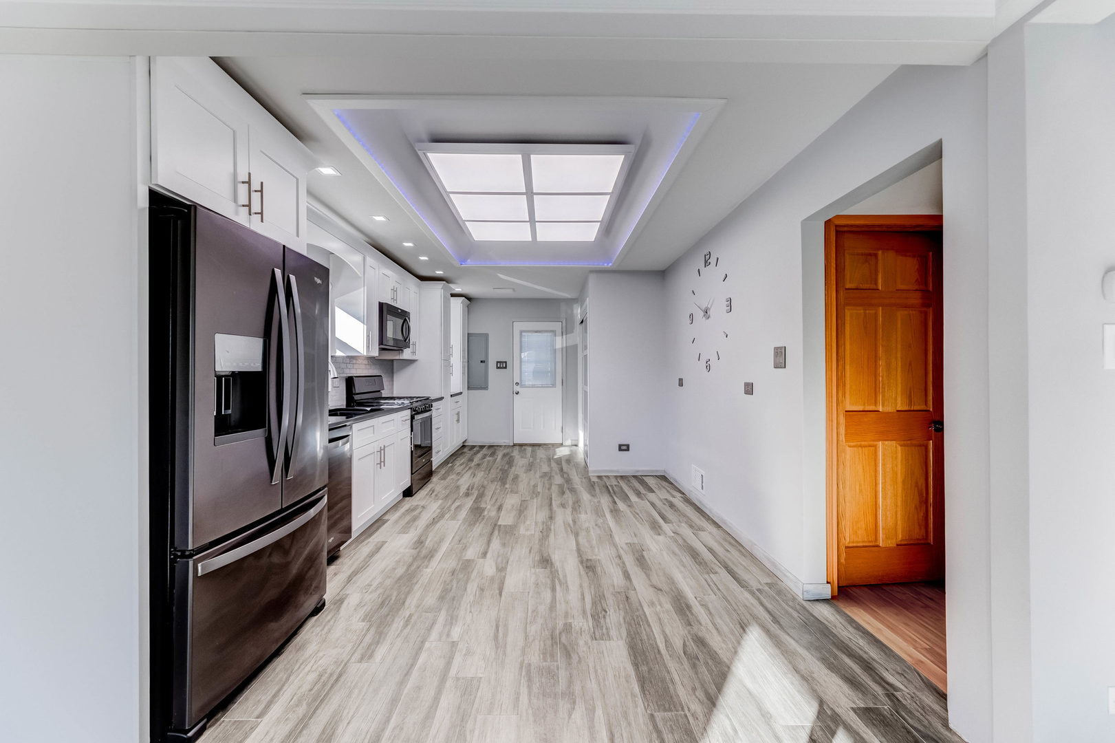7806 West 83rd Street Bridgeview, IL 60455 - Photo 13 of 53 a kitchen with a refrigerator and wooden floor