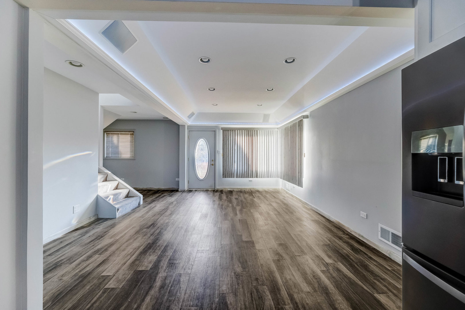 7806 West 83rd Street Bridgeview, IL 60455 - Photo 16 of 53 a view of a room with wooden floor and stairs