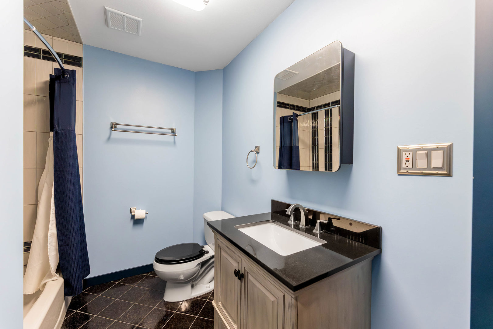 7806 West 83rd Street Bridgeview, IL 60455 - Photo 28 of 53 a bathroom with a granite countertop sink and a mirror