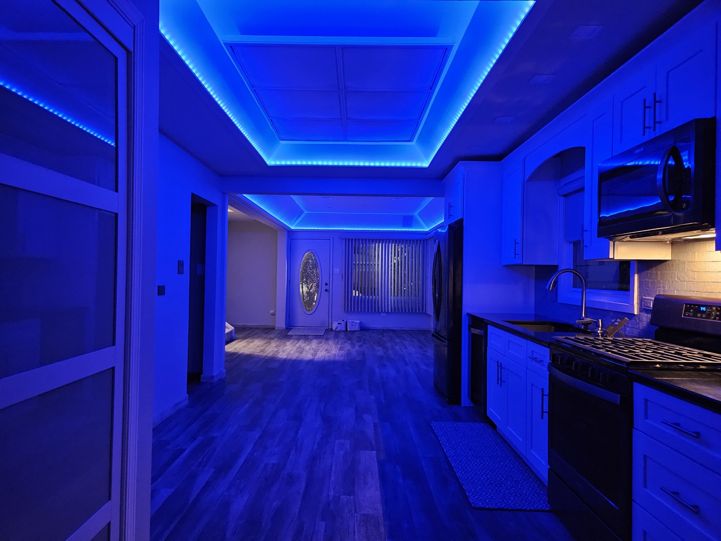 7806 West 83rd Street Bridgeview, IL 60455 - Photo 38 of 53 a kitchen with wooden floors and wooden cabinets