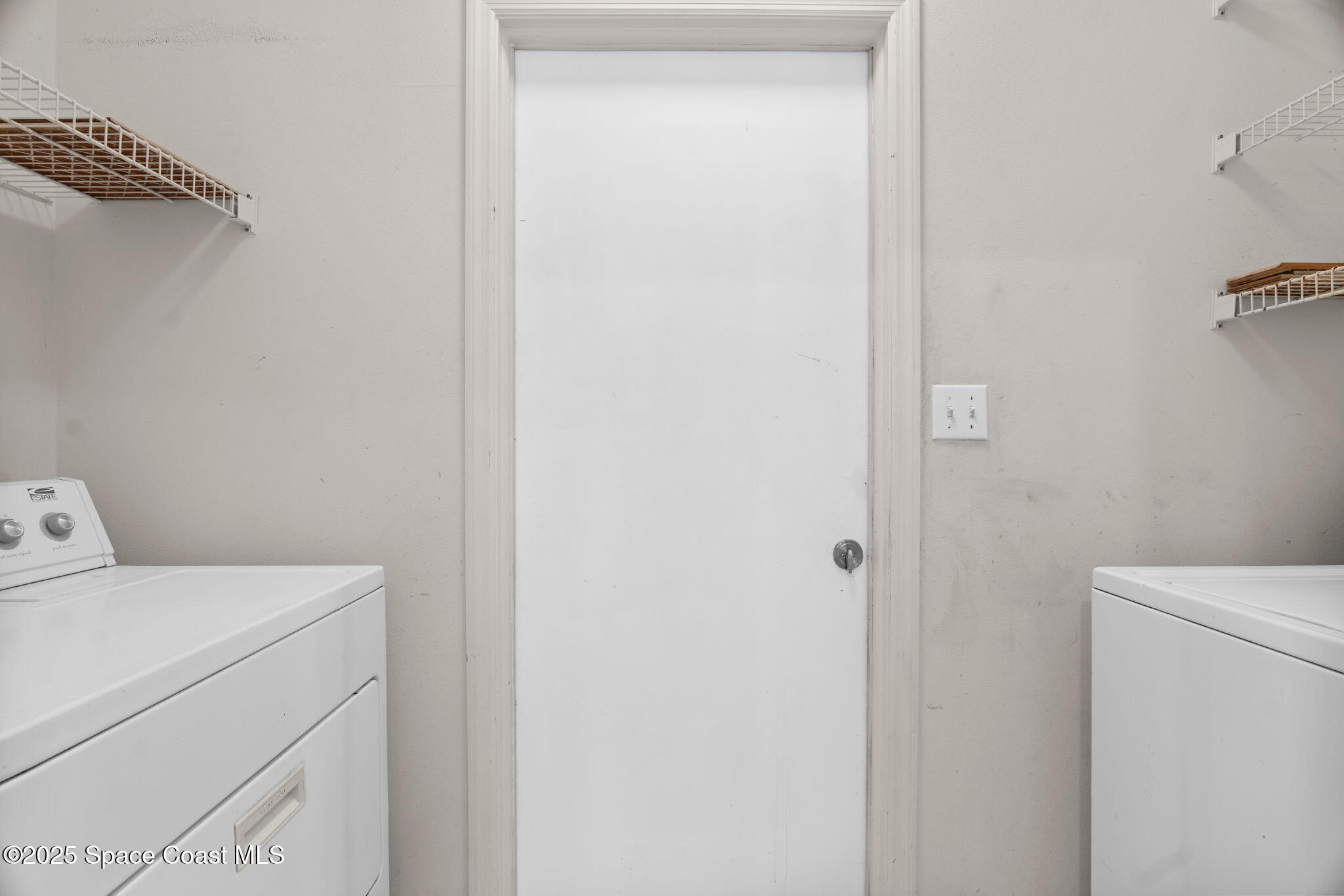 4664 Grand Meadows Boulevard Melbourne, FL 32934 - Photo 12 of 32 a utility room with dryer and washer