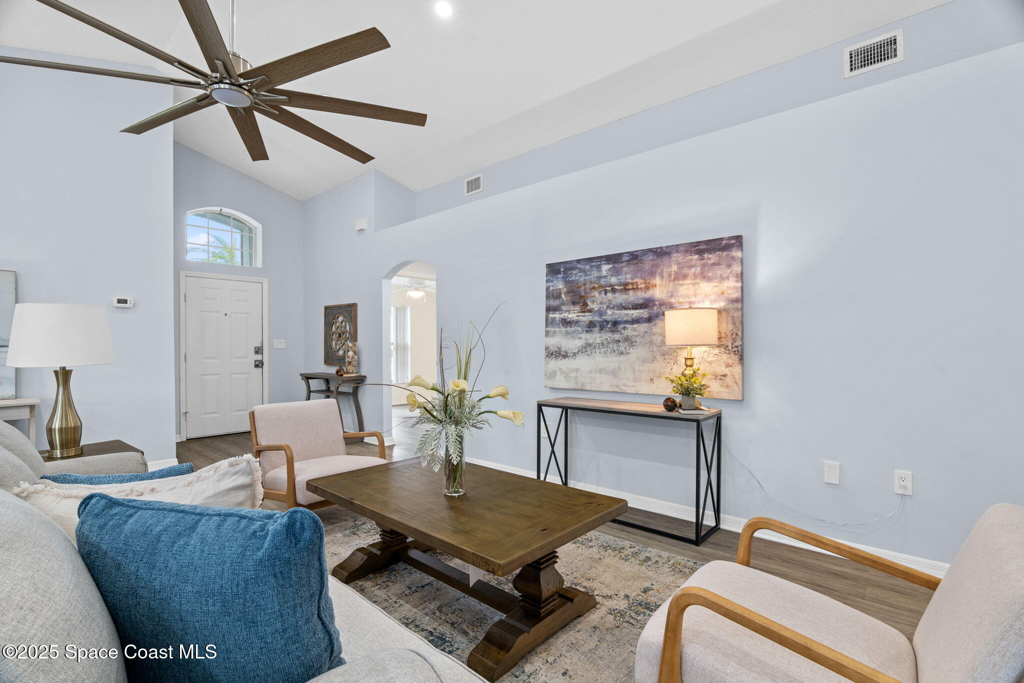 4664 Grand Meadows Boulevard Melbourne, FL 32934 - Photo 2 of 32 a living room with furniture and a window