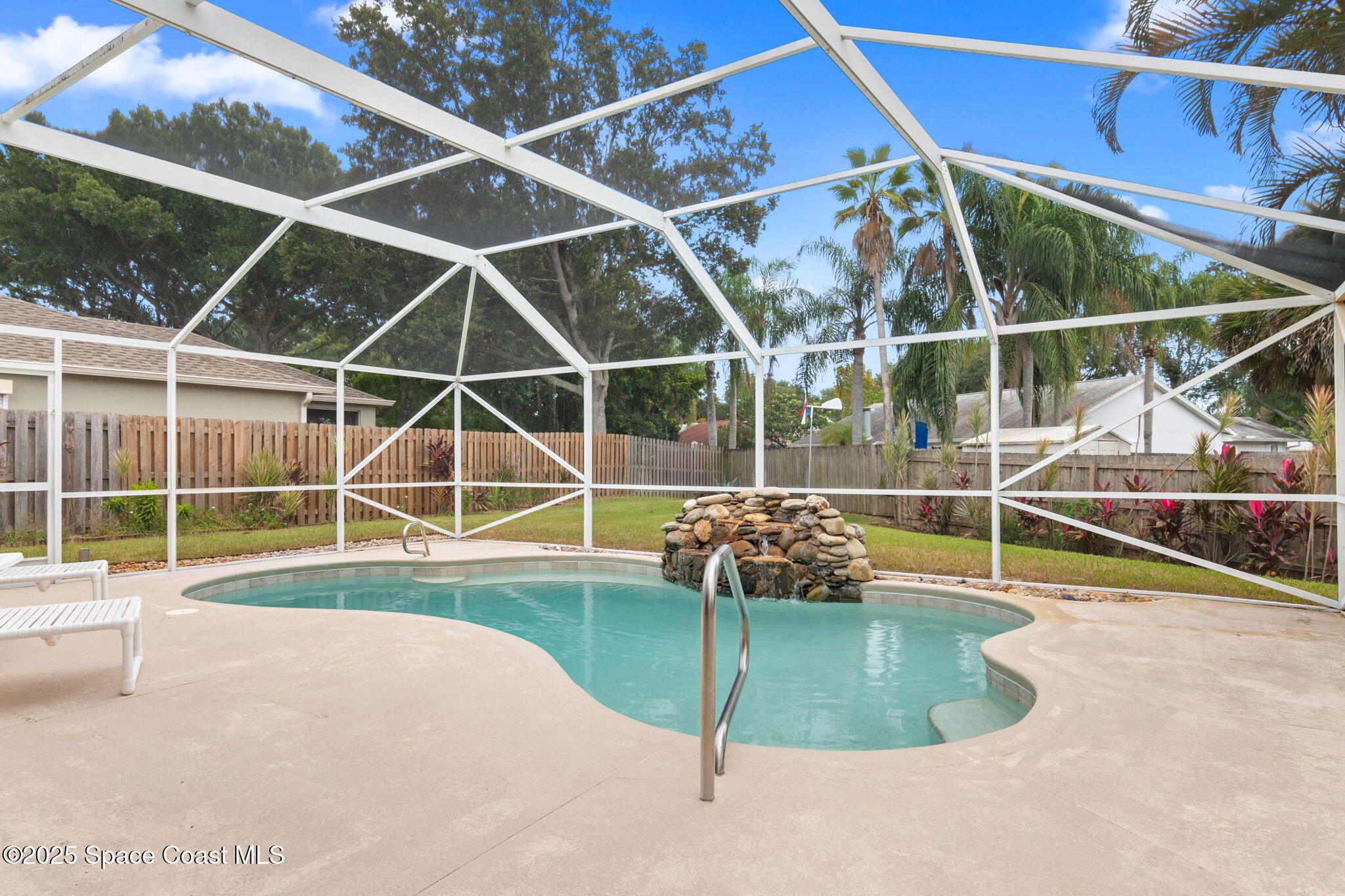 4664 Grand Meadows Boulevard Melbourne, FL 32934 - Photo 23 of 32 a view of a backyard with swimming pool