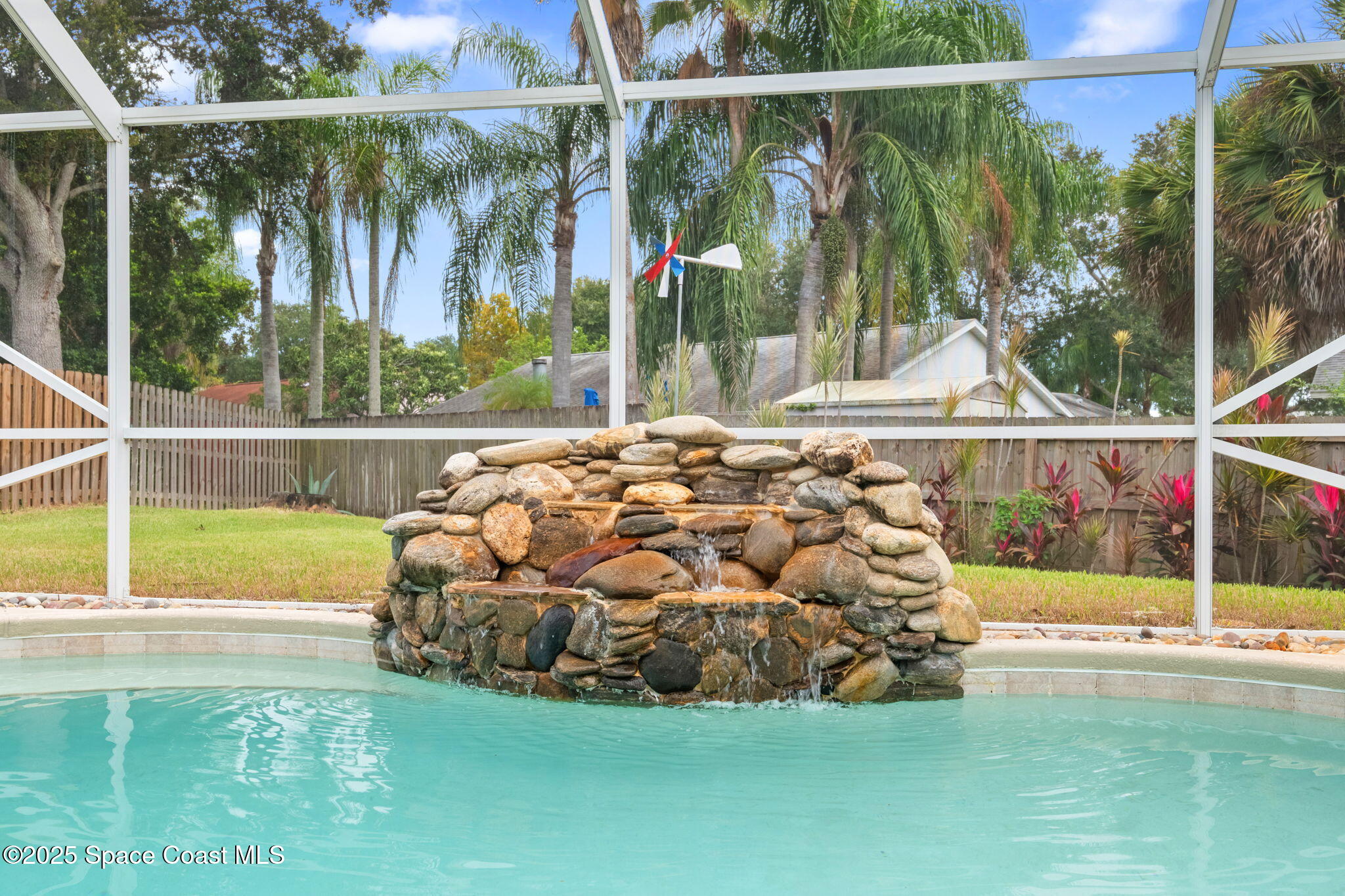 4664 Grand Meadows Boulevard Melbourne, FL 32934 - Photo 24 of 32 a view of a house with a yard and sitting area
