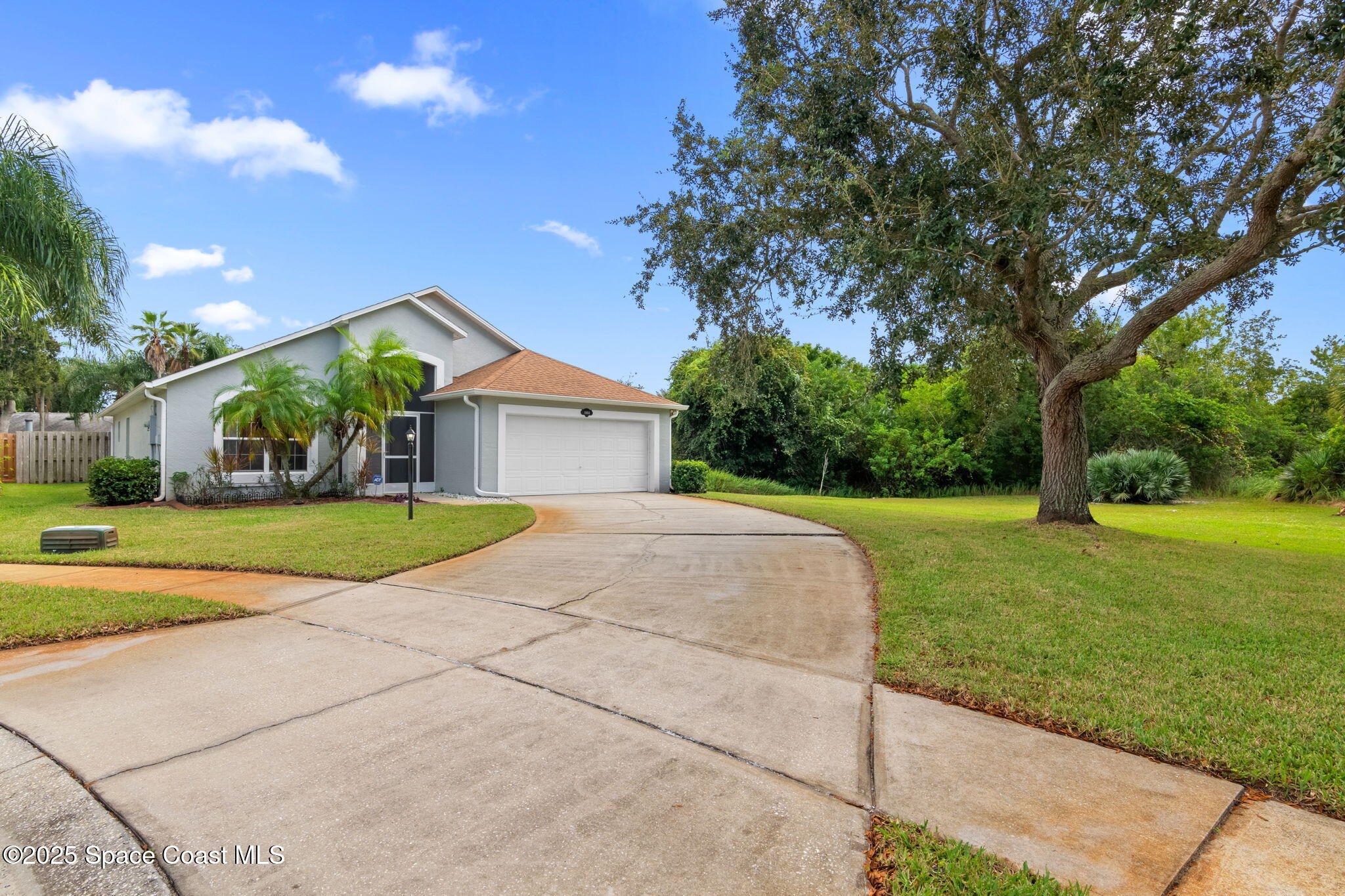 4664 Grand Meadows Boulevard Melbourne, FL 32934 - Photo 27 of 32 a view of house with outdoor space and garden