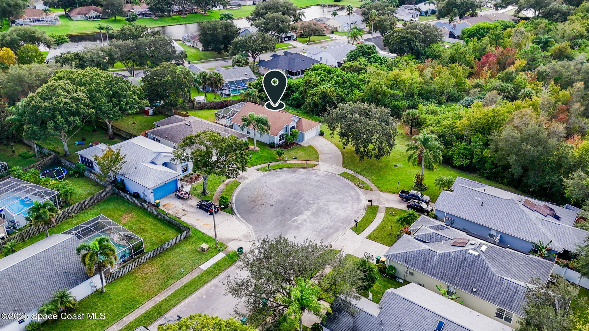 4664 Grand Meadows Boulevard Melbourne, FL 32934 - Photo 28 of 32 an aerial view of a house with a garden