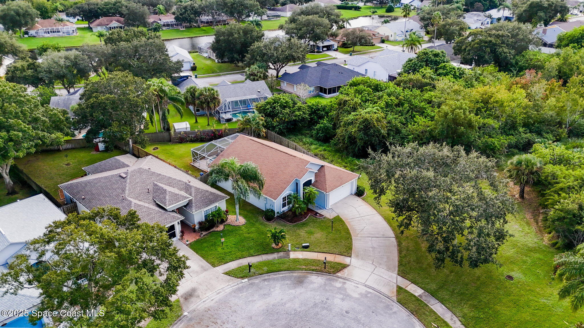 4664 Grand Meadows Boulevard Melbourne, FL 32934 - Photo 29 of 32 an aerial view of a house with a garden