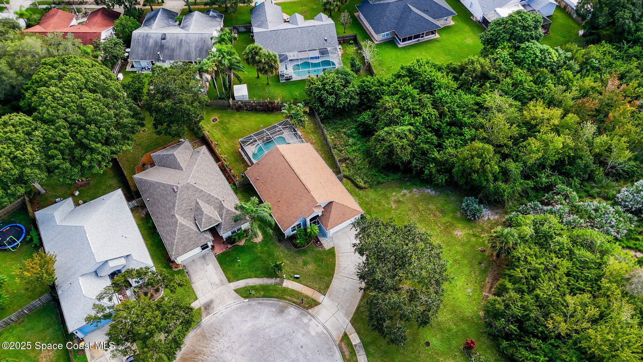 4664 Grand Meadows Boulevard Melbourne, FL 32934 - Photo 30 of 32 an aerial view of a house with a yard and outdoor seating