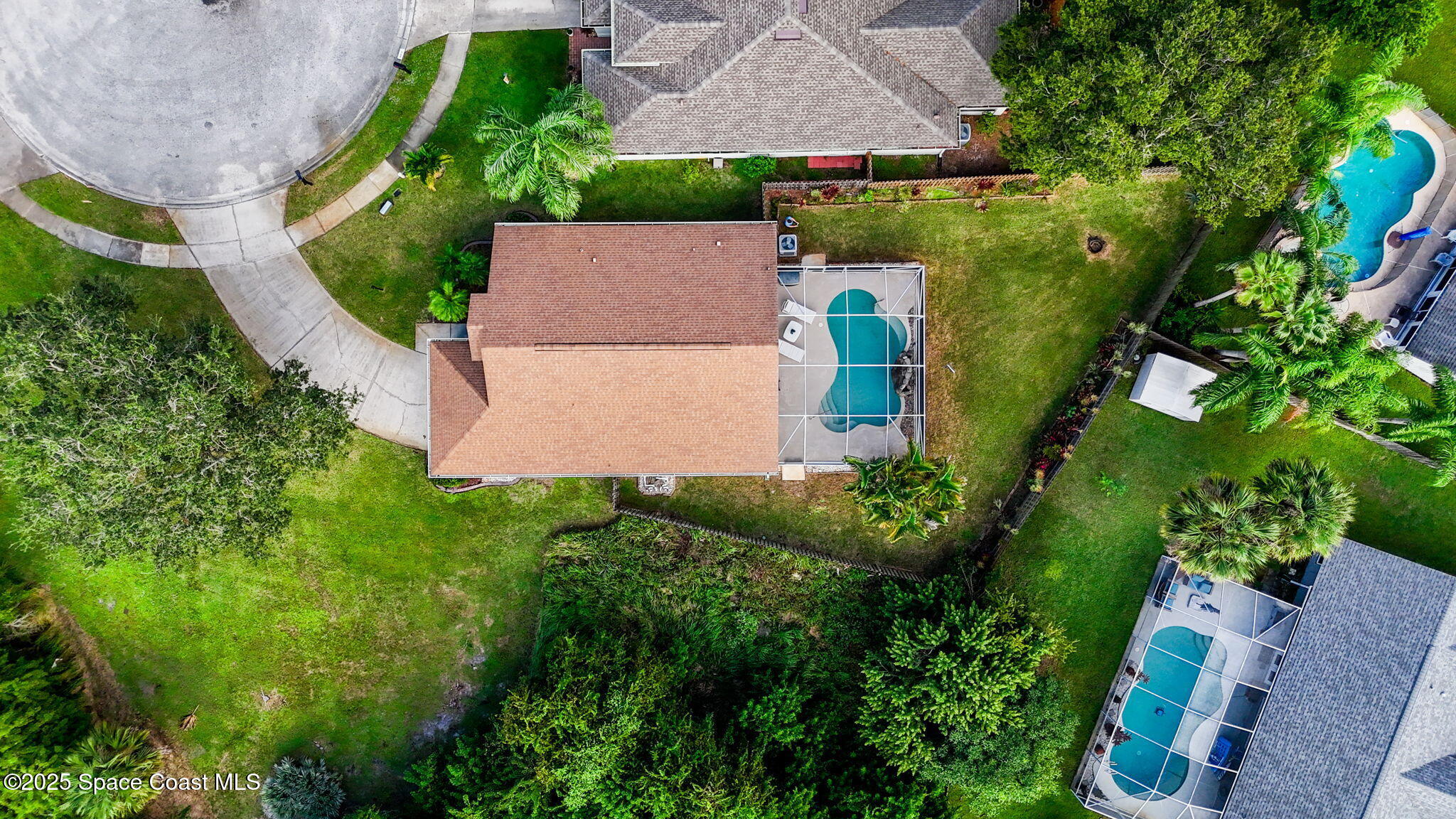 4664 Grand Meadows Boulevard Melbourne, FL 32934 - Photo 31 of 32 an aerial view of a house with a garden