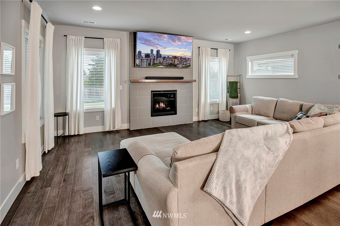 20403 South Danvers Road, Unit B Lynnwood, WA 98036 - Photo 14 of 29 a living room with furniture and a fireplace