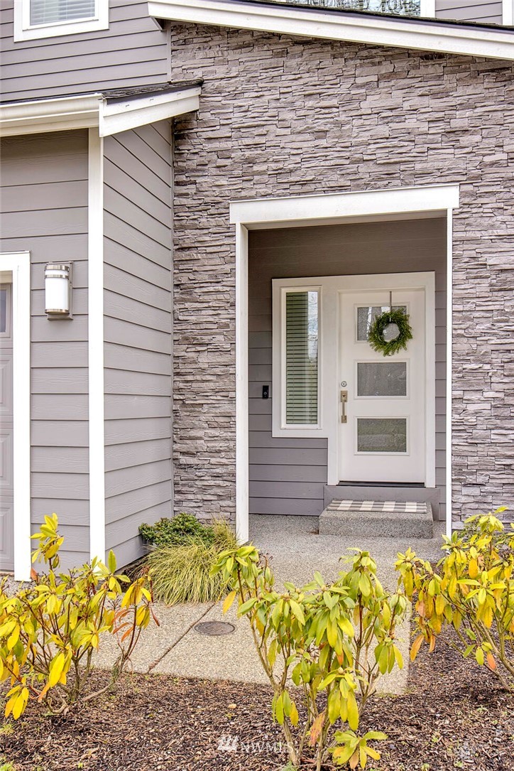 20403 South Danvers Road, Unit B Lynnwood, WA 98036 - Photo 2 of 29 a front view of a house with a yard