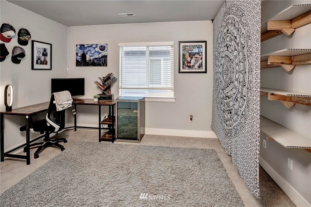 20403 South Danvers Road, Unit B Lynnwood, WA 98036 - Photo 22 of 29 a view of a workspace with a bookshelf