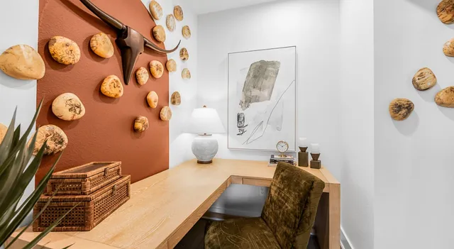 a bedroom with a bed and painted walls