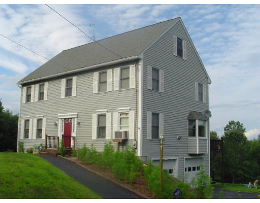 135 Clark Road Shirley, MA 01464 - Photo 1 of 10 a front view of residential houses with yard