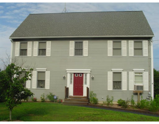135 Clark Road Shirley, MA 01464 - Photo 3 of 10 a front view of a house with garden