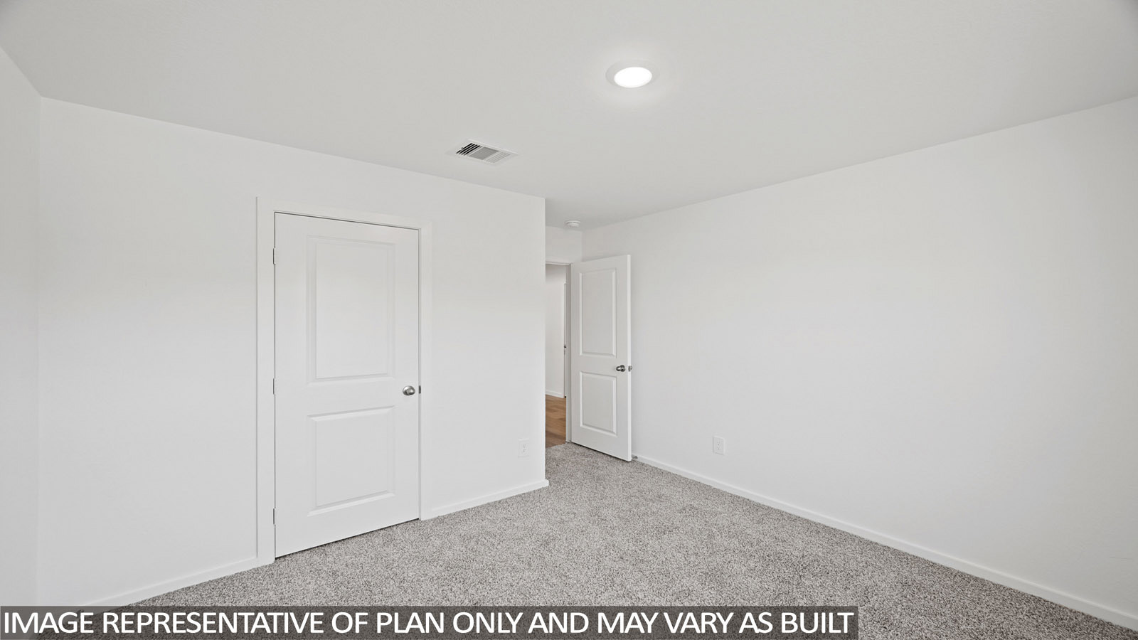 165 Baby Calf Roping Road Jarrell, TX 76537 - Photo 18 of 24 A spacious, neutral room offers a blank canvas for personalization, complete with soft carpeting and contemporary recessed lighting.