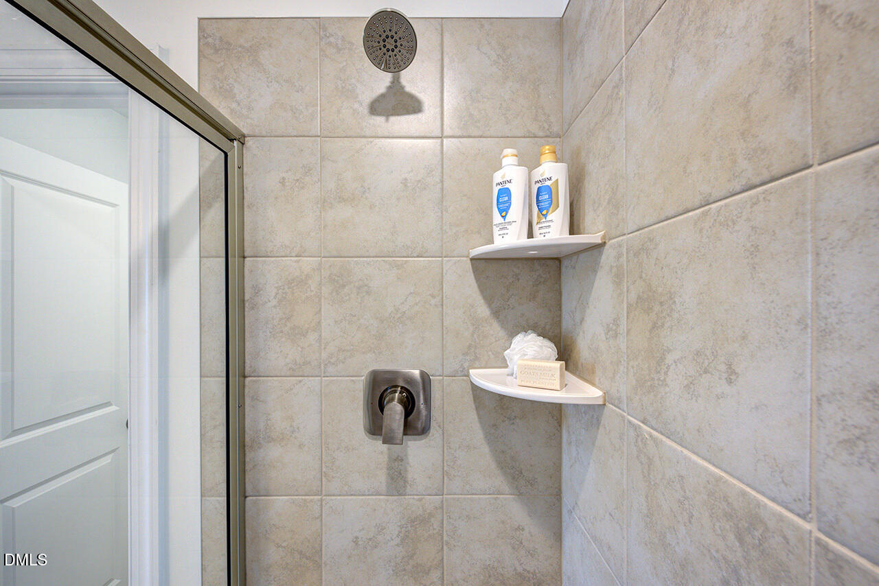 51 Shay Street Angier, NC 27501 - Photo 27 of 41 a bathroom with a sink and a mirror