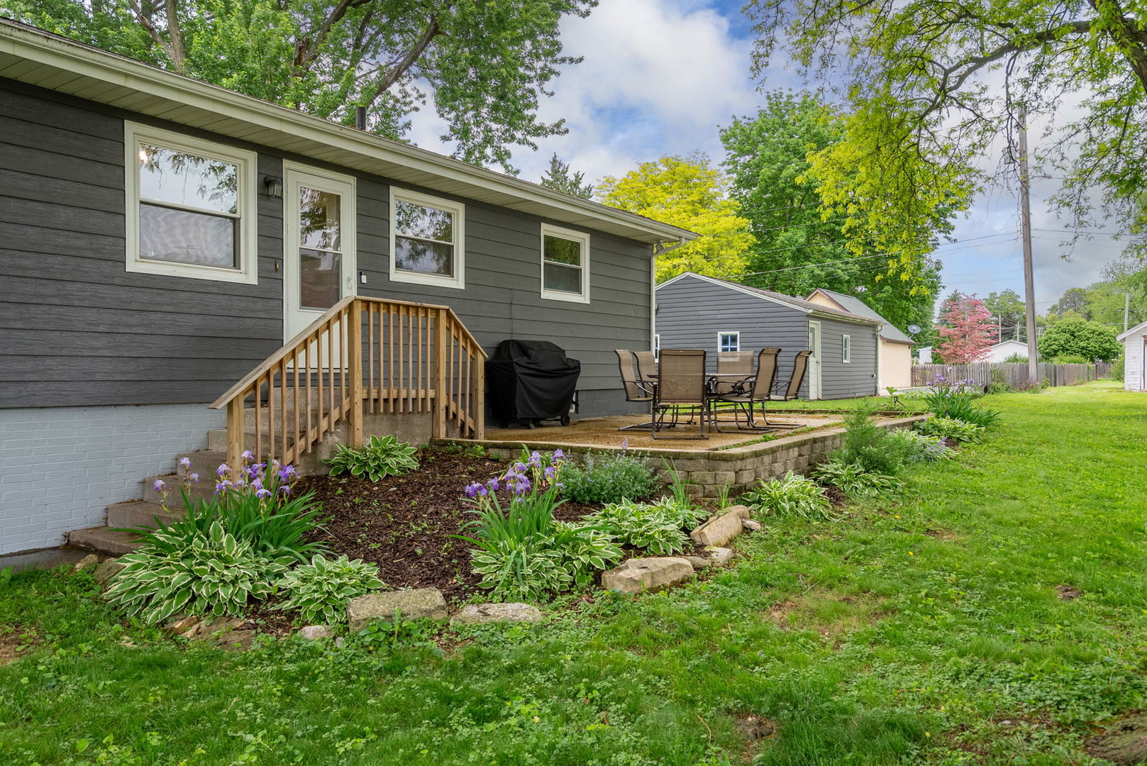 1435 26th Avenue Moline, IL 61265 - Photo 30 of 38 a view of a house with a yard and garden