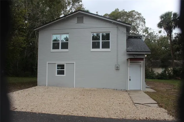 a house with trees in the background