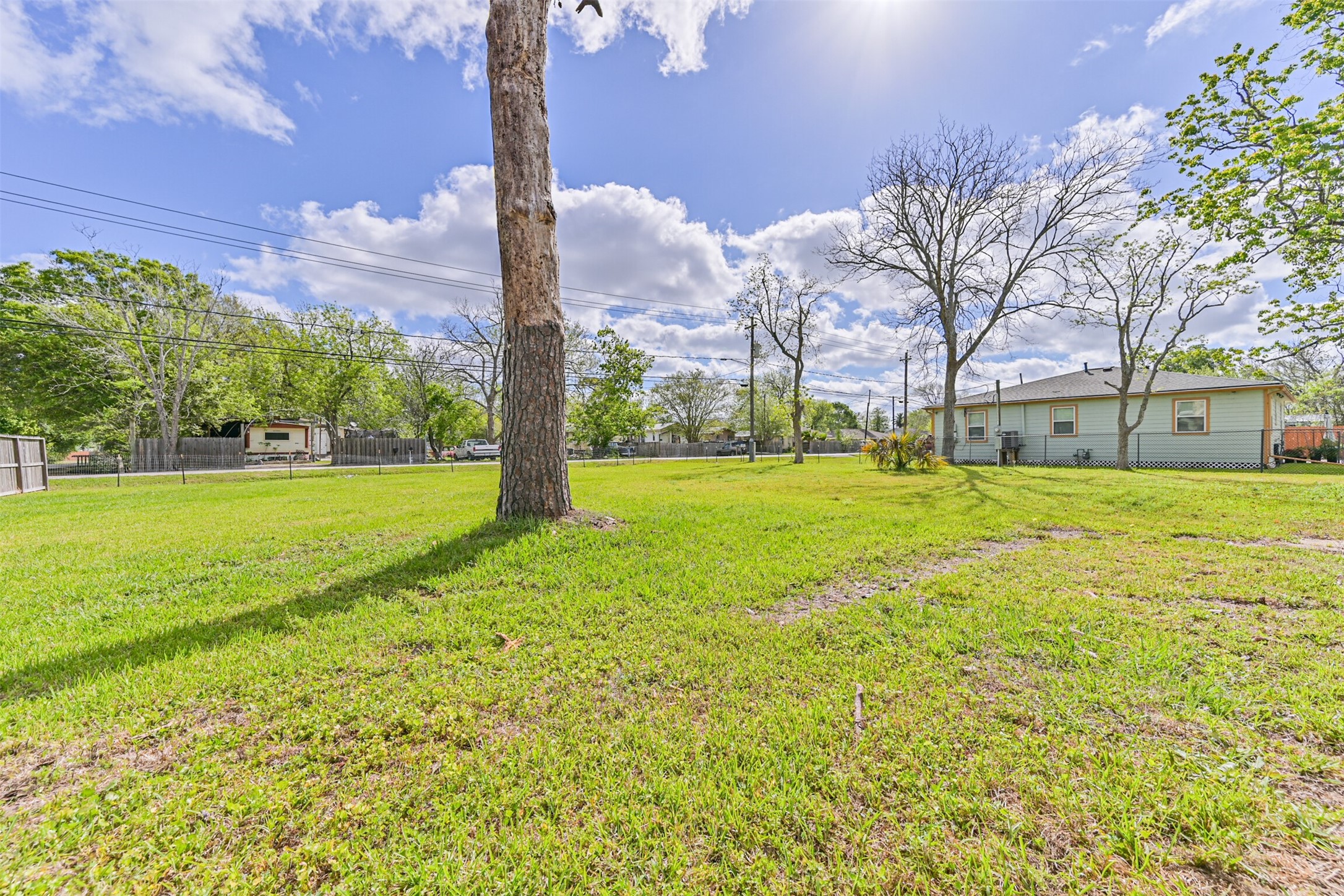 4702 10th Street Bacliff, TX 77518 - Photo 27 of 33 a backyard of a house with lots of green space and fountain