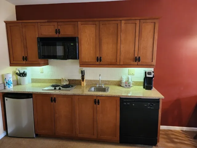 a outdoor living space with furniture and a flat screen tv