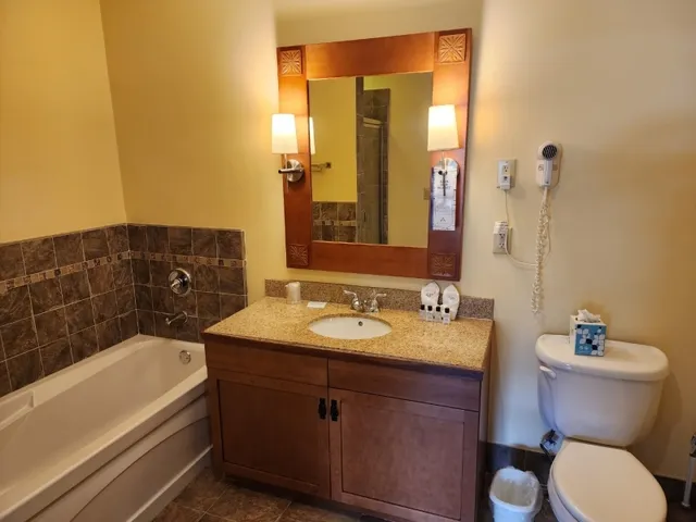 a bathroom with a shower and a sink