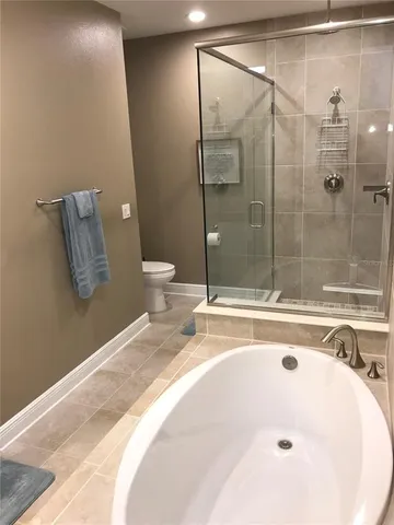 a bathroom with a bathtub and a sink