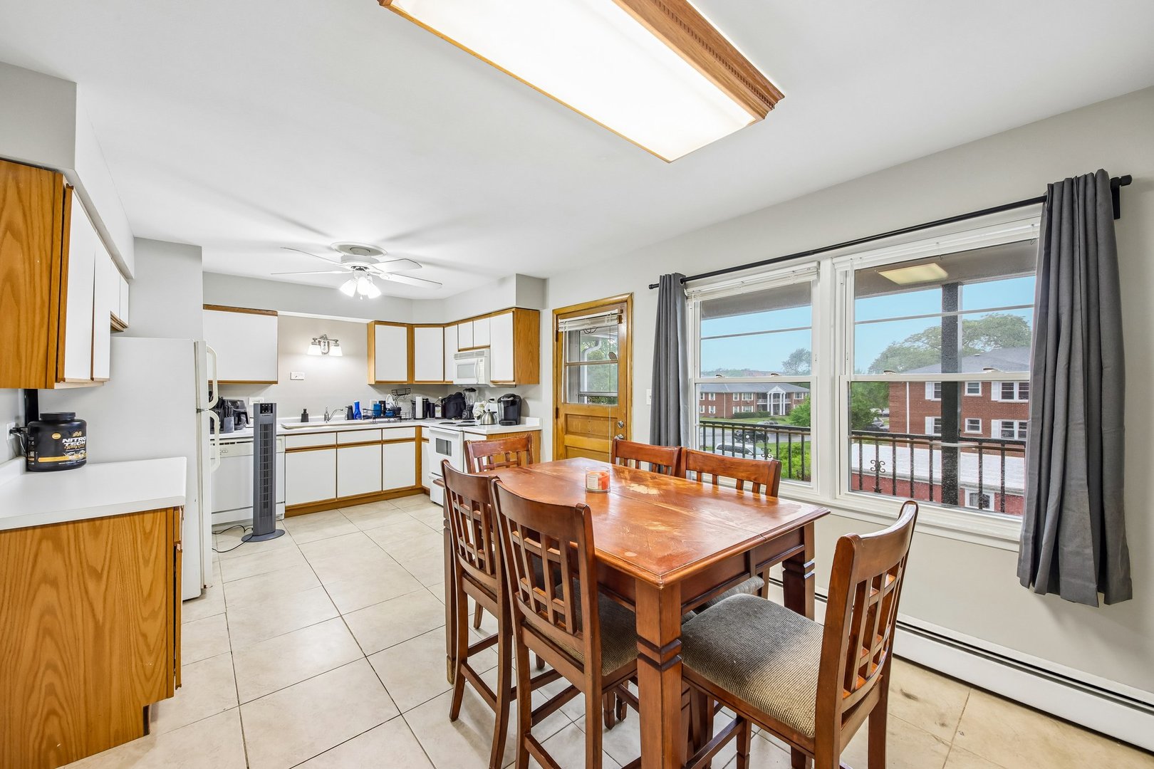 1855 Parkside Drive, Unit 8 Park Ridge, IL 60068 - Photo 10 of 22 a dining room with furniture and large windows