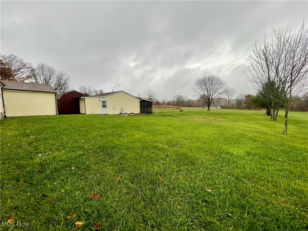 9945 Quarry Road Amherst, OH 44001 - Photo 22 of 30 View of yard featuring an outdoor structure