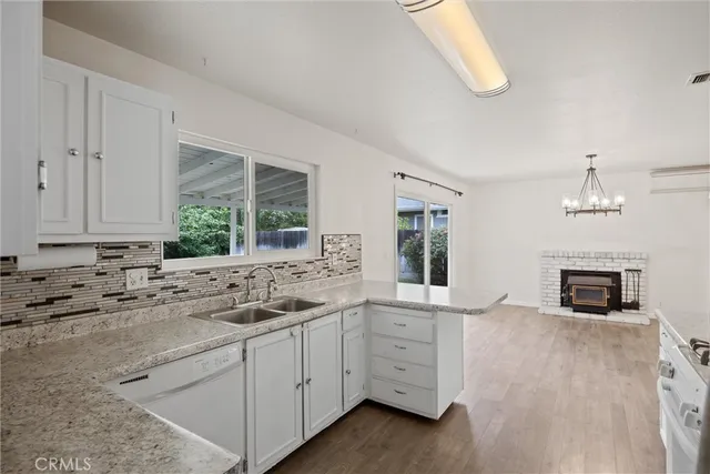 a kitchen with a sink and cabinets