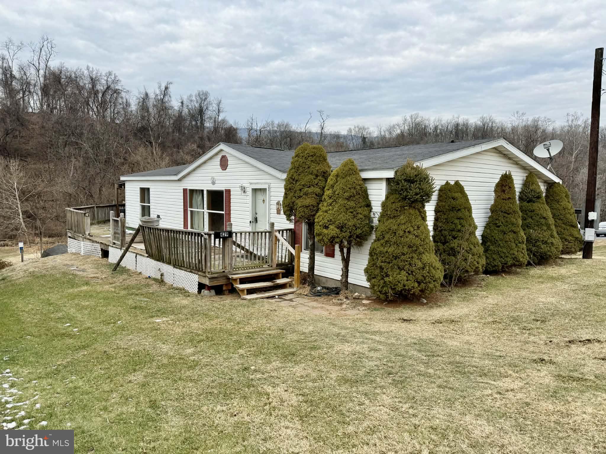 a view of a house with wooden fence