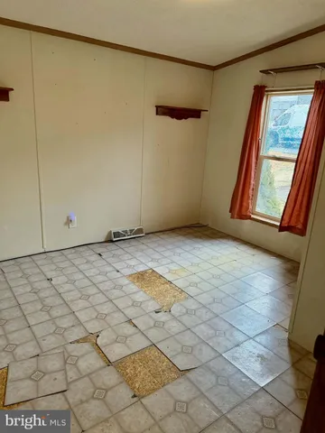 a view of a chairs and table in patio
