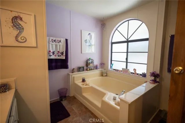 a room with a bed and a window