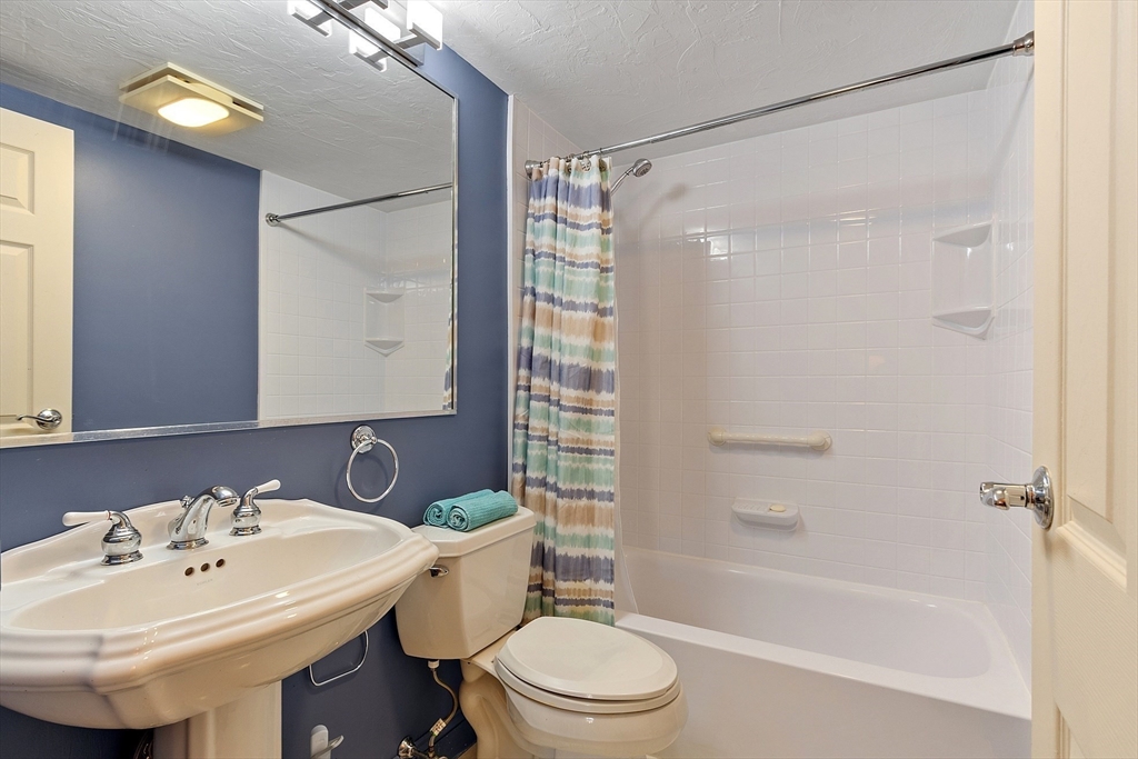 190 High Street, Unit 605 Medford, MA 02155 - Photo 18 of 37 a bathroom with a sink toilet and shower