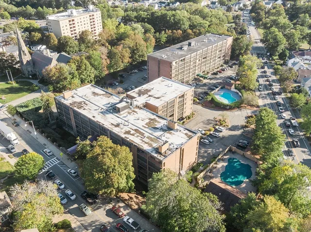 an aerial view of a house with a yard
