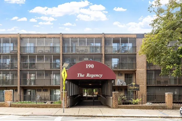 a front view of a building with a street