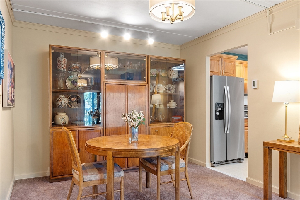 190 High Street, Unit 605 Medford, MA 02155 - Photo 9 of 37 a view of a dining room with furniture and chandelier
