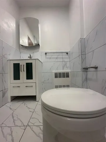 a bathroom with a bathtub and a sink