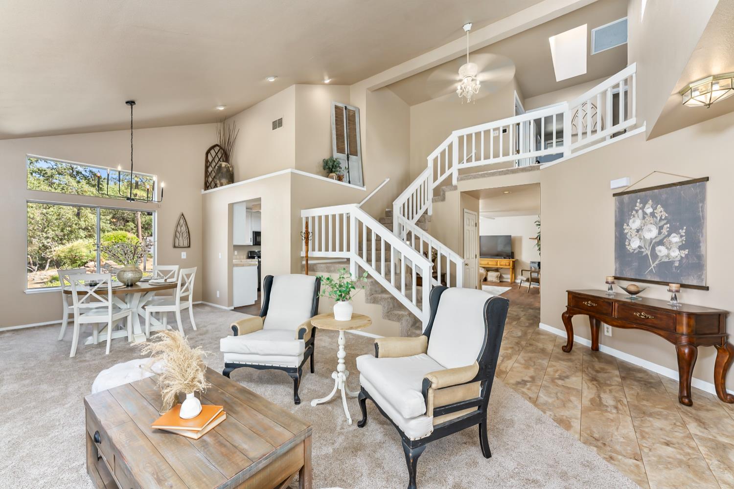 3472 See View Court Rescue, CA 95672 - Photo 10 of 56 a living room with furniture and a chandelier
