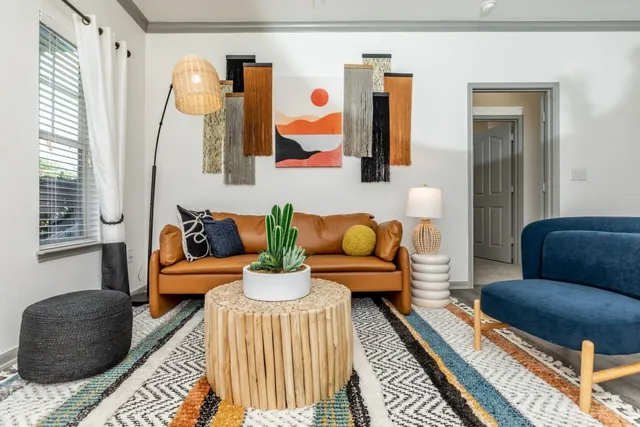 a living room with furniture and a rug