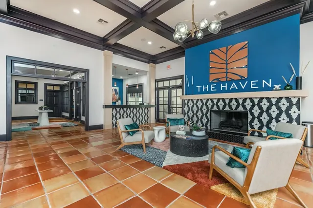 a outdoor living space with furniture a rug and a chandelier