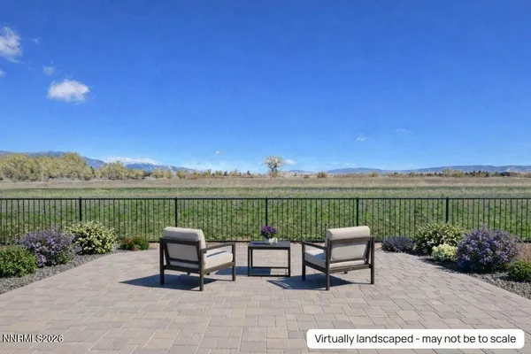 a view of a lake with couches in the patio