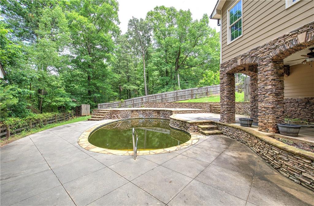 561 Holland Road Dallas, GA 30157 - Photo 41 of 48 a view of a swimming pool with a yard