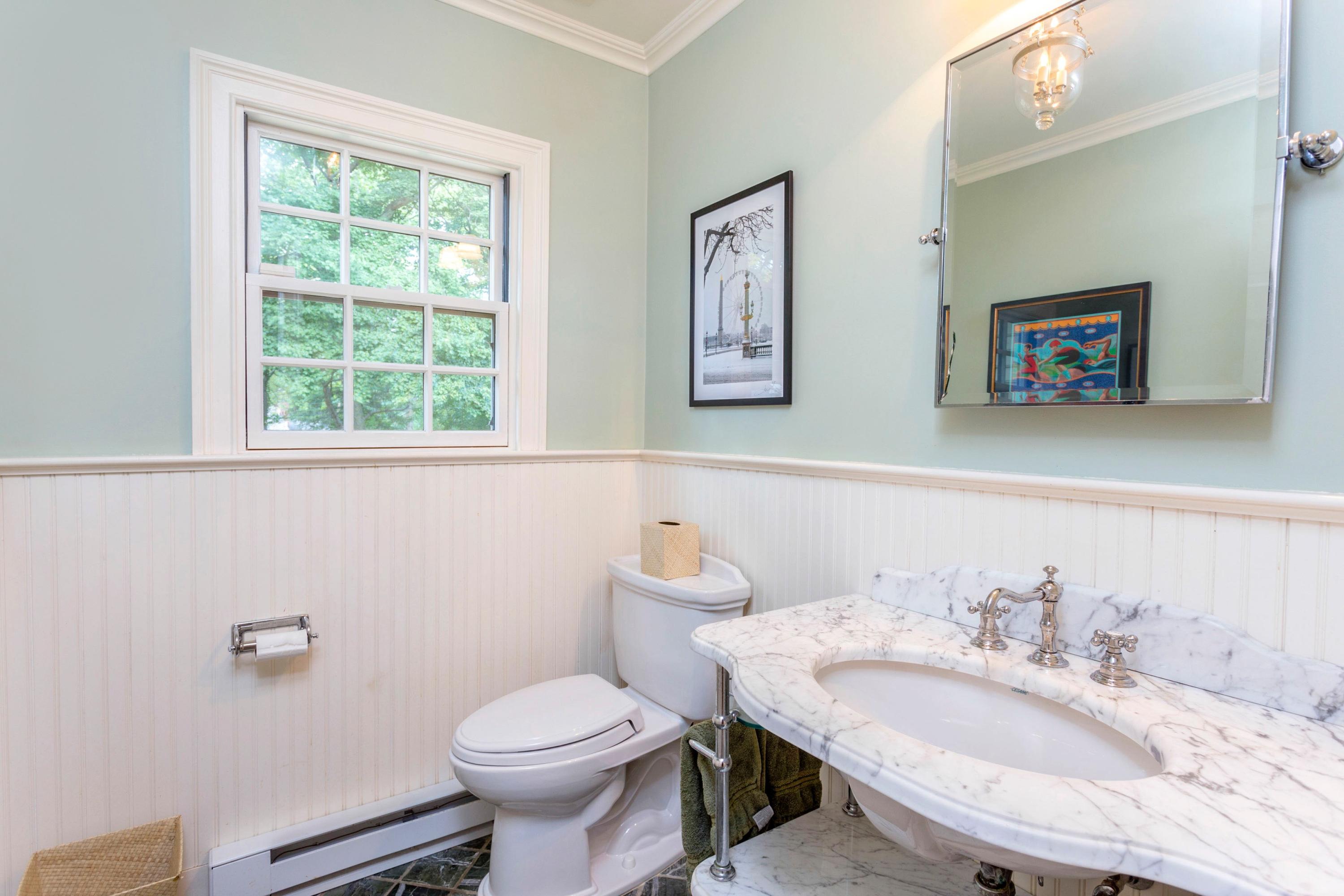 34 Country Club Road Darien, CT 06820 - Photo 12 of 17 a bathroom with a toilet a sink and a window